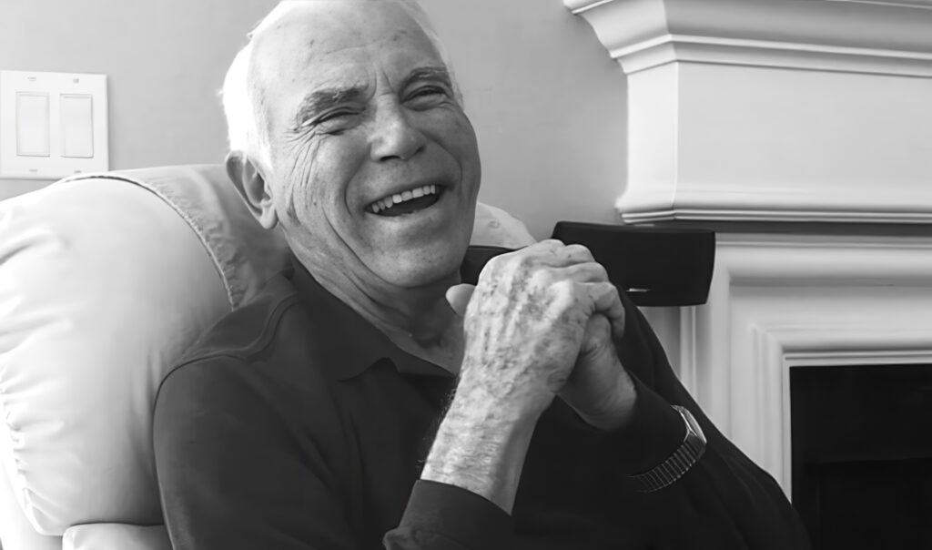 harvey wichman laughing in a chair